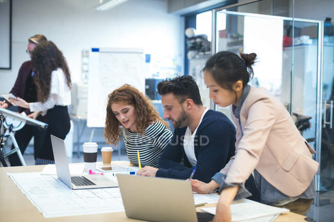 Executives discussing with each other in office — Stock Photo