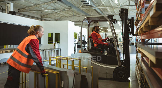 Staffs loading boxes in the factory warehouse — Stock Photo