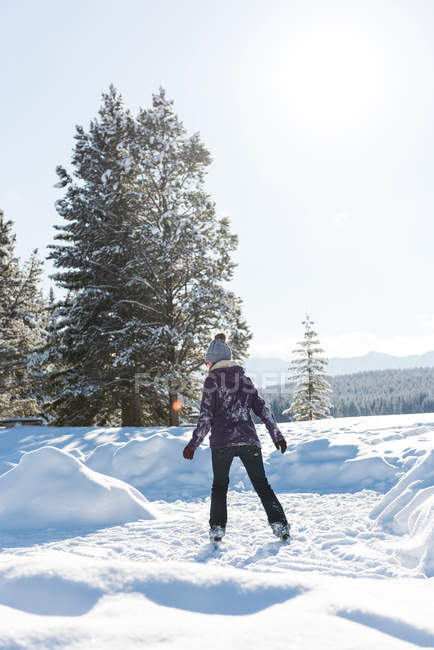 Woman skating in snowy landscape during winter. — Stock Photo