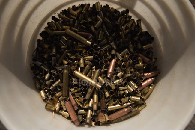 Close-up view heap of bullets in container — Stock Photo