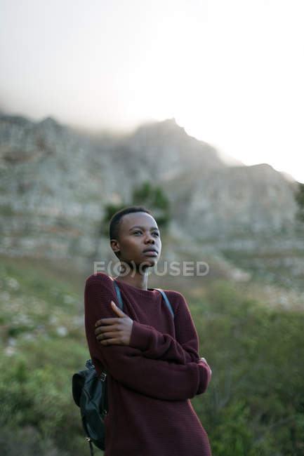 Thoughtful woman shivering at countryside — Stock Photo