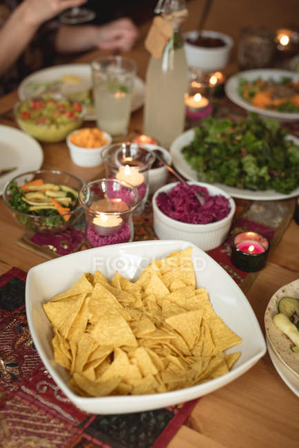 Closeup view variety of food served on table — Stock Photo