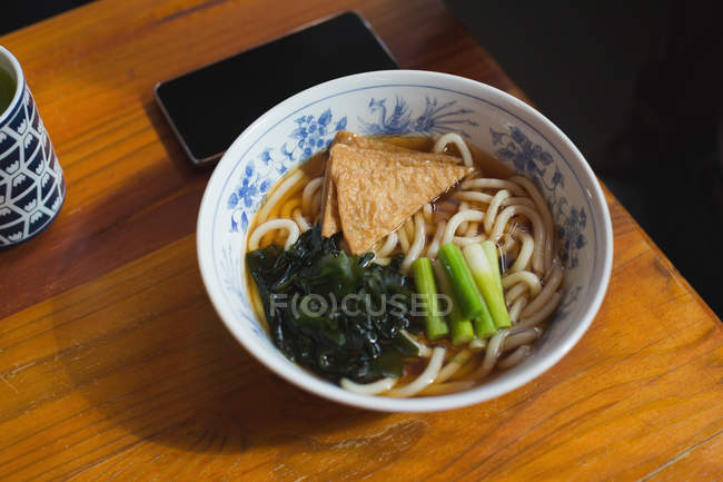 Close-up of noodles in bowl at restaurant — Stock Photo