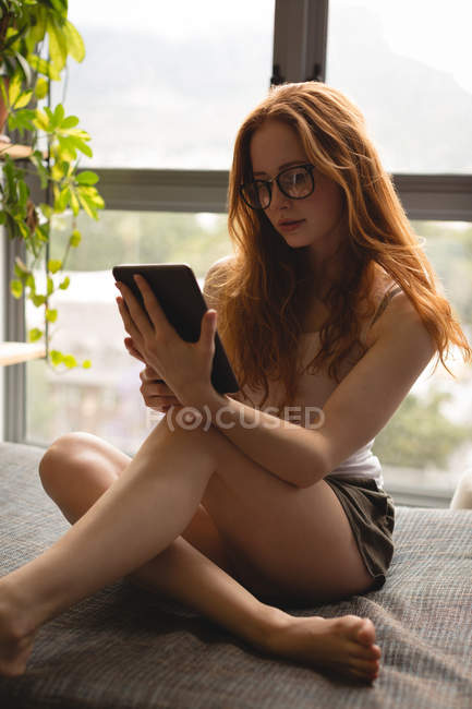 Woman using digital tablet at home — Stock Photo