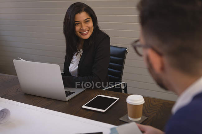 Business colleagues talking in conference room at office. — Stock Photo