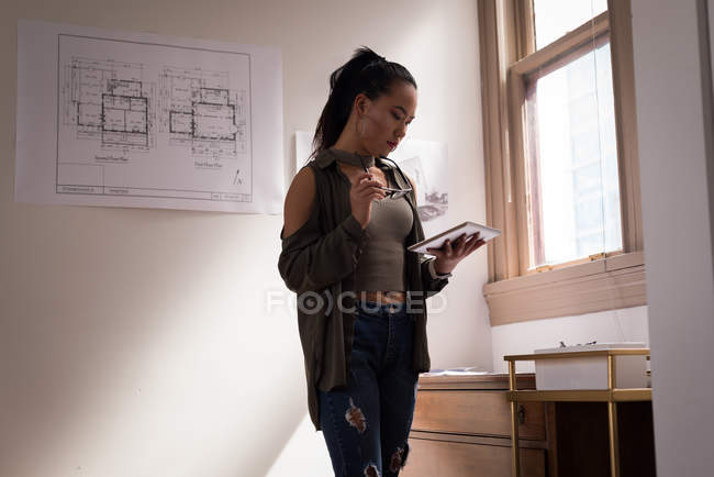 Business executive using digital tablet in office. — Stock Photo