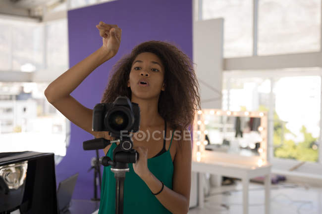Professional photographer taking pictures in a professional studio — Stock Photo