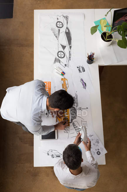 Business colleagues working at desk, high angle view. — Stock Photo