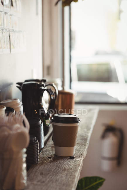 Close-up view of disposable glass and jug on table — Stock Photo