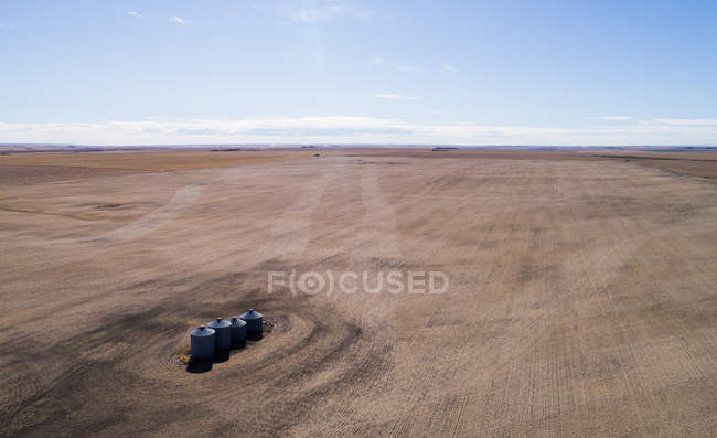 Aerial of containers in field on sunny day — Stock Photo