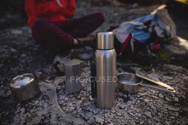 Close-up of cooking equipment for hiker in background — Stock Photo