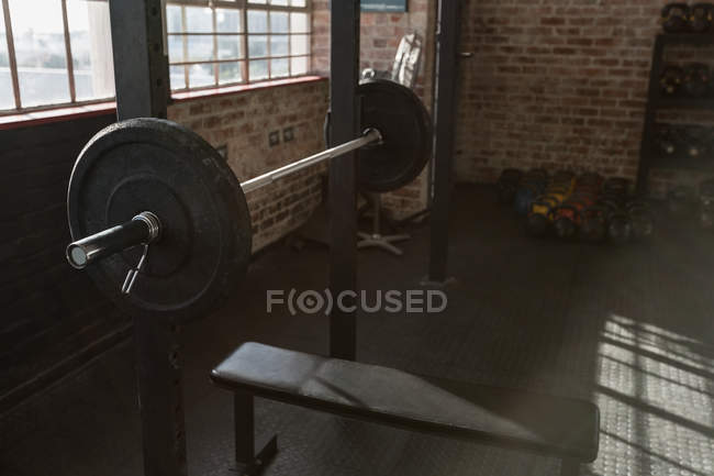 Close-up of barbell bench in fitness studio. — Stock Photo