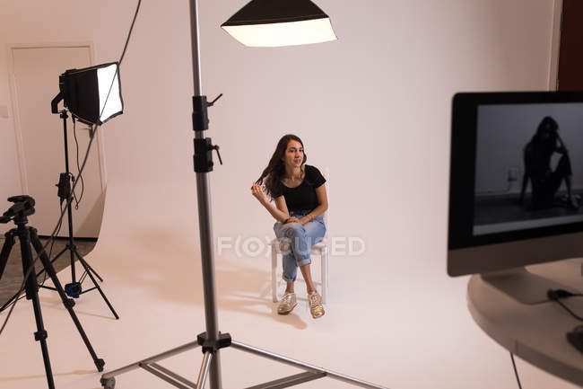 Beautiful female model posing in photo studio — Stock Photo