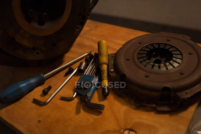 Various tools with mac wheel in garage — Stock Photo