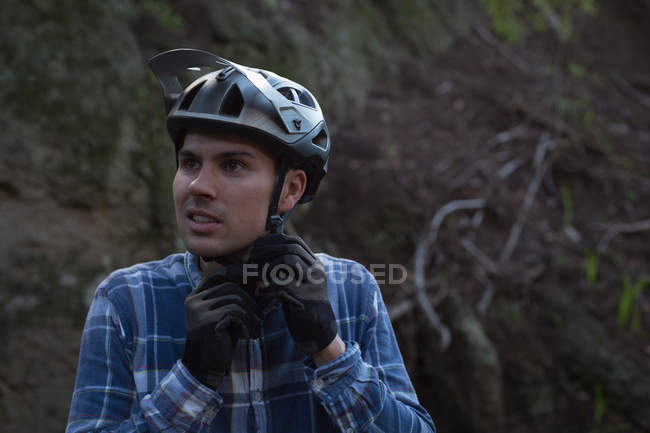 Young man wearing helmet on lane — Stock Photo