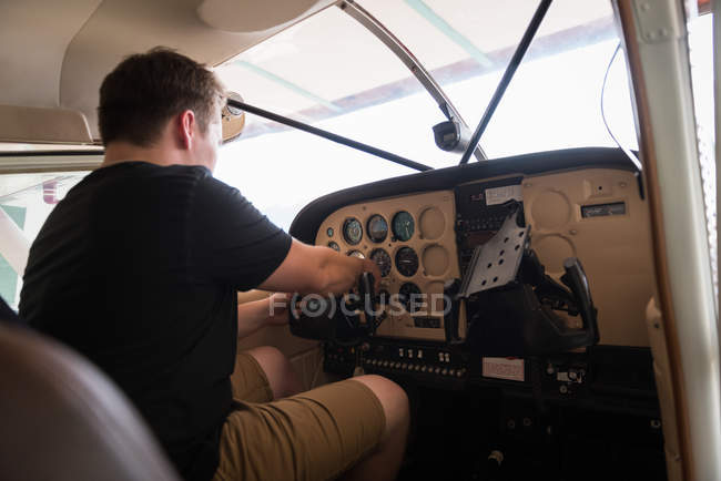 Side view of pilot ready to start the aircraft — Stock Photo
