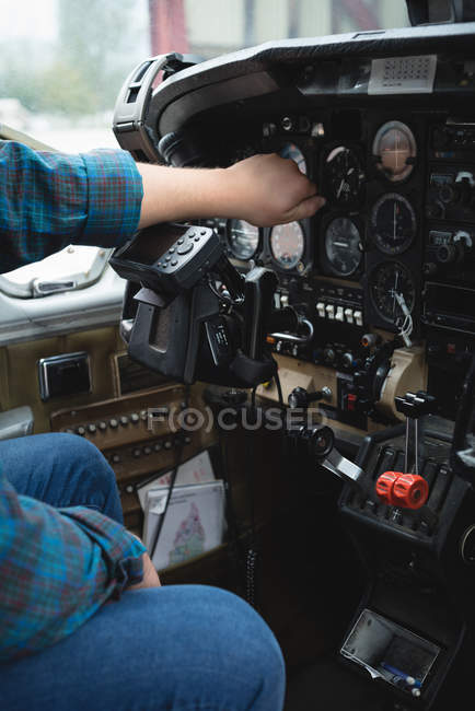 Close-up of engineer operating cockpit — Stock Photo