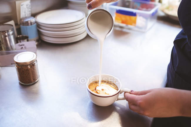 Close-up of female waiter preparing coffee in food truck — Stock Photo