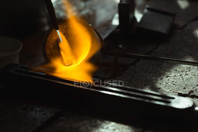 Close-up of metal being heated in workshop — Stock Photo