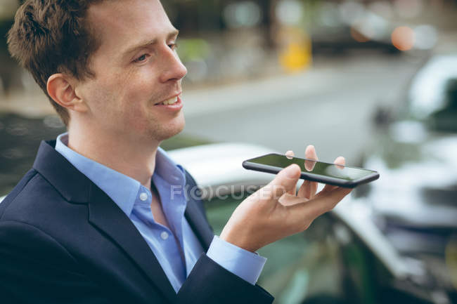 Close-up of businessman talking on mobile phone — Stock Photo