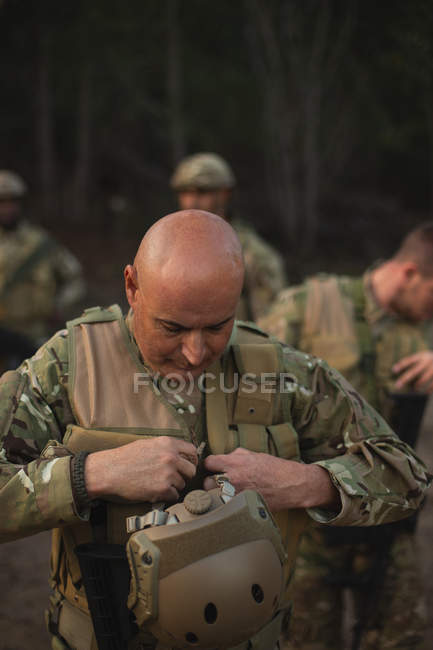 Military soldier wearing bulletproof vest during military training — Stock Photo