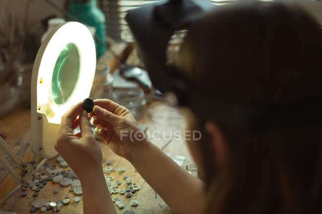 Close-up of jewelry designer working in workshop — Stock Photo
