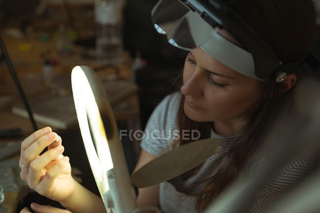 Close-up of Jewelry designer working in workshop — Stock Photo