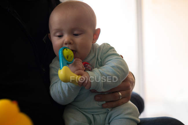 Baby boy with his father playing with toy at home — Stock Photo