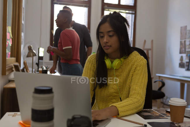 Female executive working on desk in office — Stock Photo