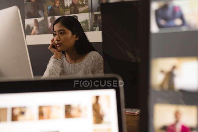 Beautiful female executive working in office — Stock Photo