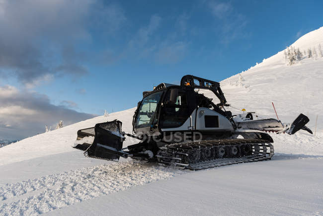 Snowplow truck cleaning snow during winter — Stock Photo