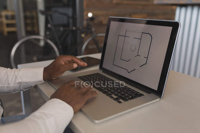Mid section of business people using invisible digital tablets in meeting — Stock Photo