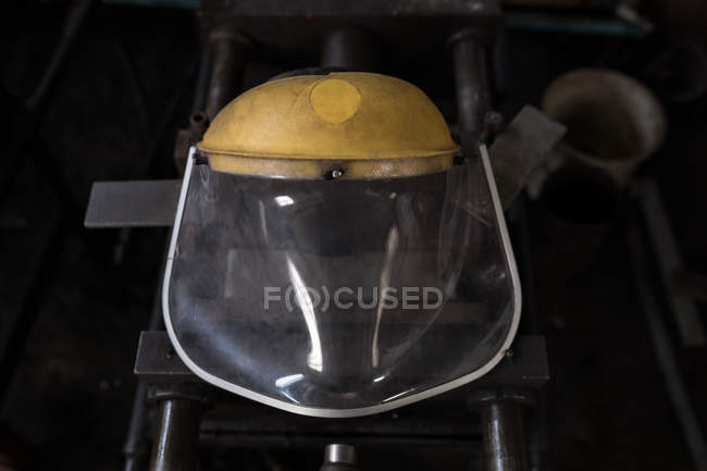 Close-up of protective helmet in workshop — Stock Photo