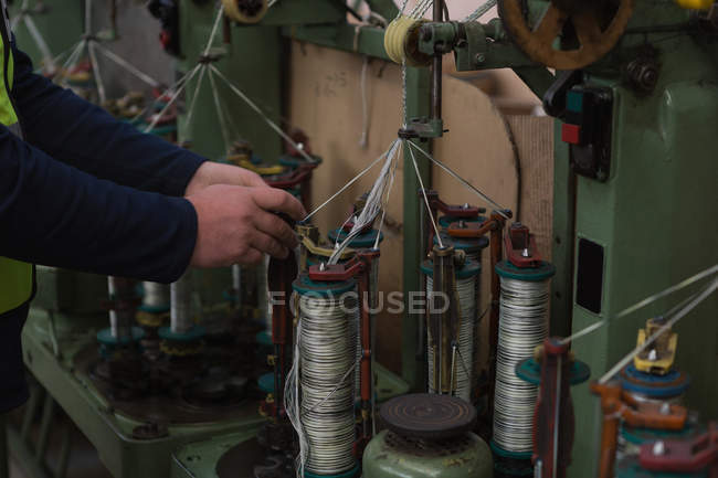 Attentive worker working in rope making industry — Stock Photo