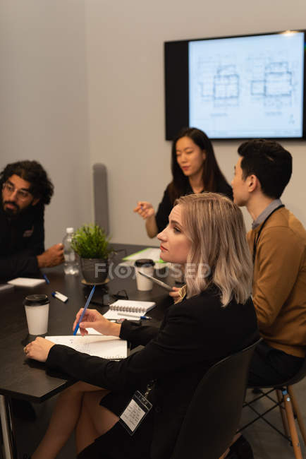 Executives working on table in conference room at office — Stock Photo