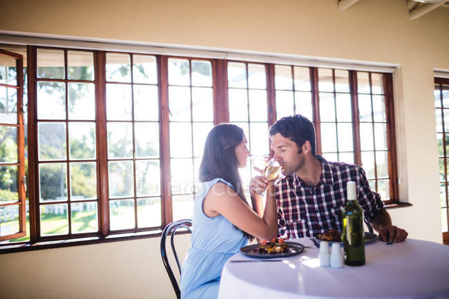 Romantic couple having wine in restaurant — Stock Photo