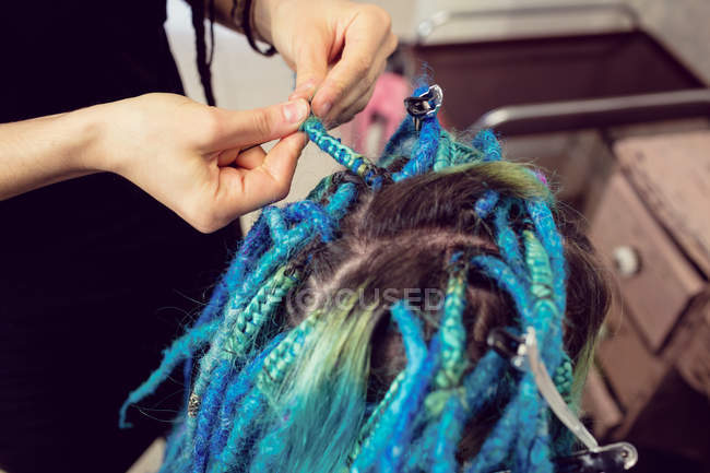 Close-up of beautician styling clients hair in dreadlocks shop — dyed hair,  blue - Stock Photo | #225273110