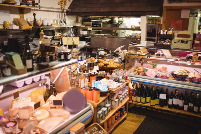 Various types of food display at counter in cafe — Stock Photo