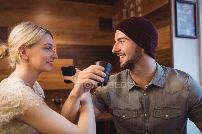 Romantic couple having sake drinks in restaurant — Stock Photo