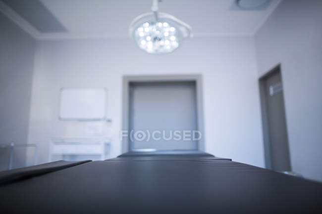 Stretcher and surgical lights in operation room at hospital — Stock Photo