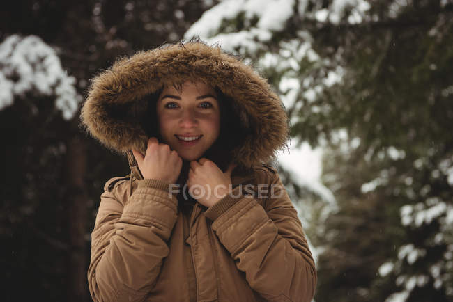 Portrait of smiling woman in fur jacket during winter — Stock Photo