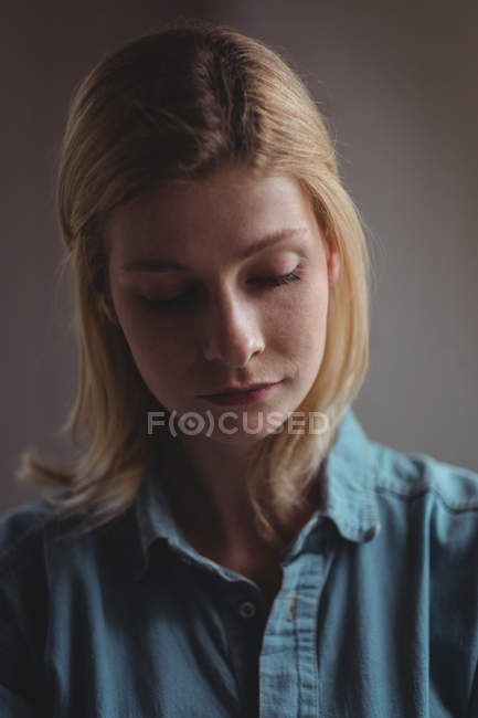 Close-up of thoughtful woman at home — Stock Photo