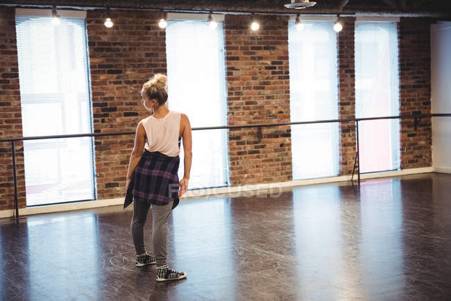Woman practicing a dance move in dance studio — Stock Photo