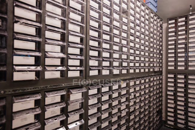 Shelves and drawers in storage room of a repair centre — Stock Photo