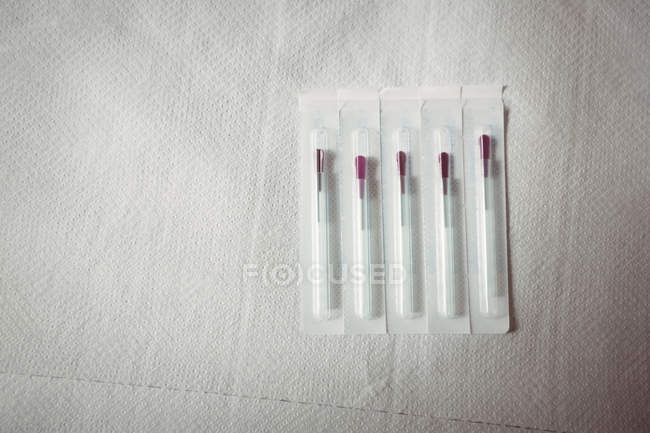 Close-up of dry needles in sealed packets — Stock Photo