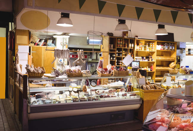 Various types of food display at counter in cafe — Stock Photo