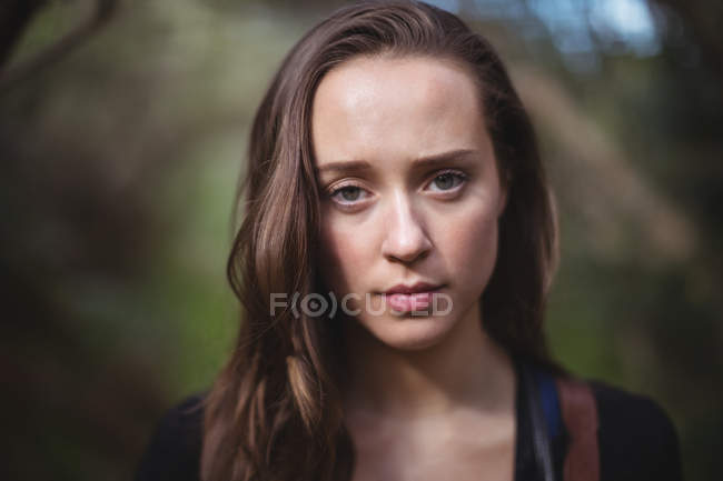 Portrait of beautiful woman in forest — Stock Photo