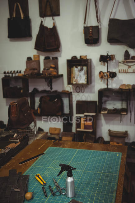 Various work tools on table in workshop — Stock Photo