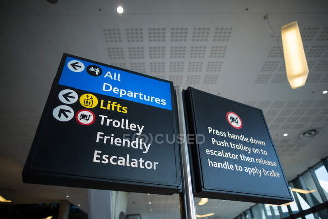 Close-up of information board at airport — Stock Photo