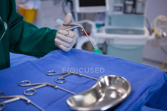 Surgeon performing operation in operation room at hospital — Stock Photo